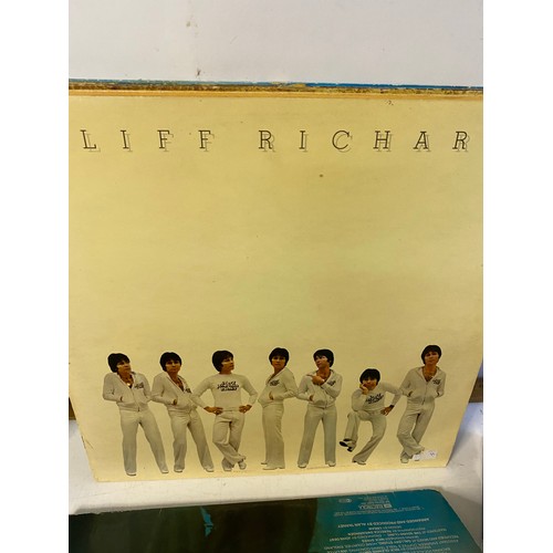 218 - Selection of Cliff Richards records, CDs and books.