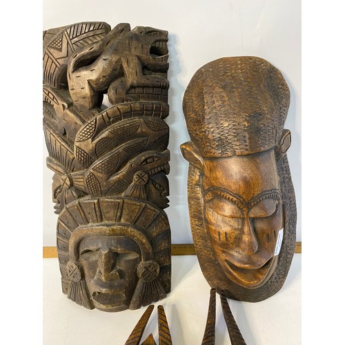 437 - Selection of 4 x African wooden masks, largest measuring 40 cms