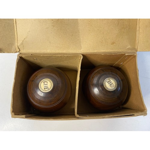 222 - Pair of antique Thomas Taylor lignum vitae lawn bowls in original cardboard box