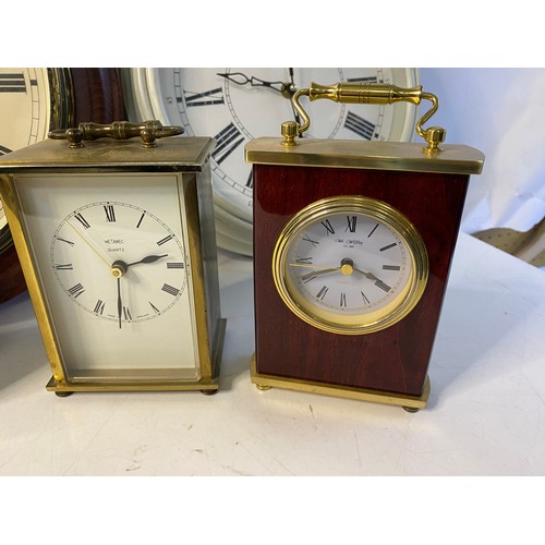 228 - A selection of quartz table and wall clocks.