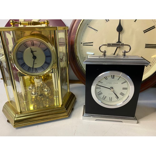 228 - A selection of quartz table and wall clocks.