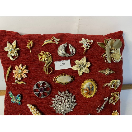 250 - Cushion of vintage brooches.