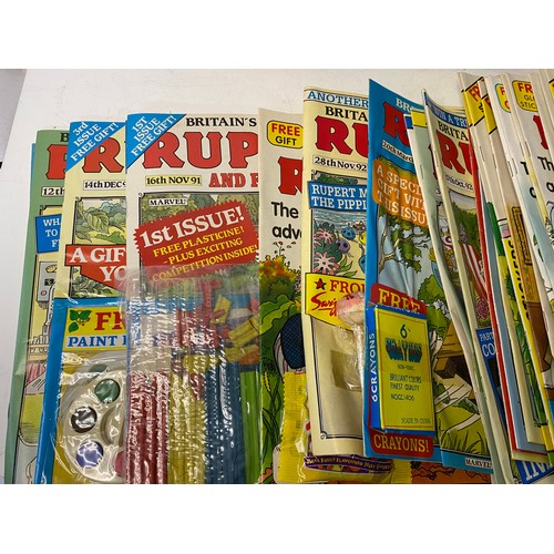 262 - Box of vintage Rupert books and comics from 1970's -90's. Many still have the free gifts attached.