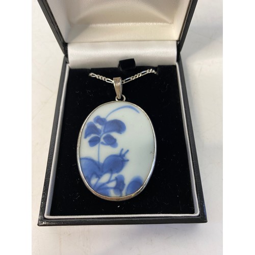 309 - Chinese porcelain pendant set in silver mount on 925 silver chain.