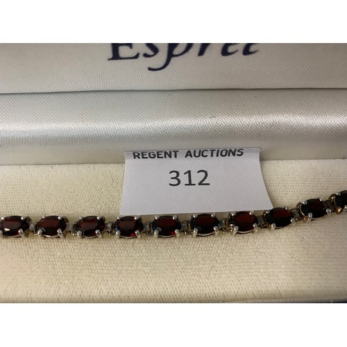 312 - 925 silver and garnet tennis bracelet.