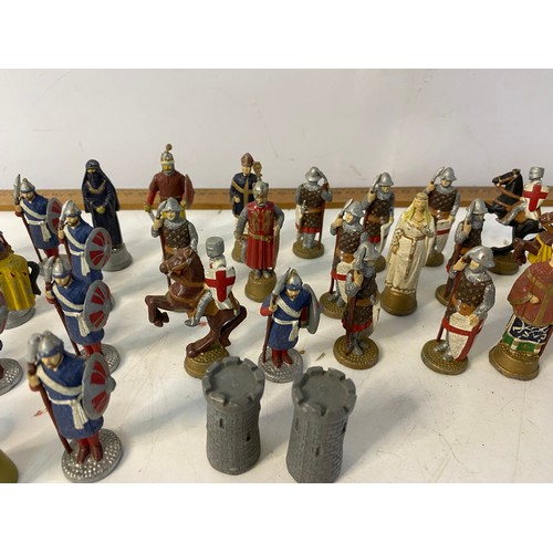 375 - Selection of 32 lead figures approx 6 cms tall which form a complete chess set featuring the Moors a... 