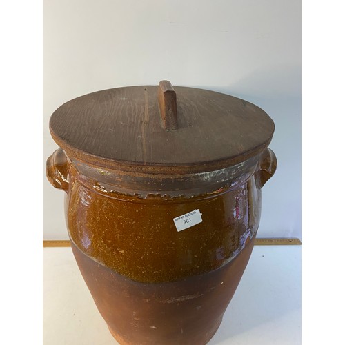 461 - Large terracota glazed planter measuring 53 cms tall with wooden lid