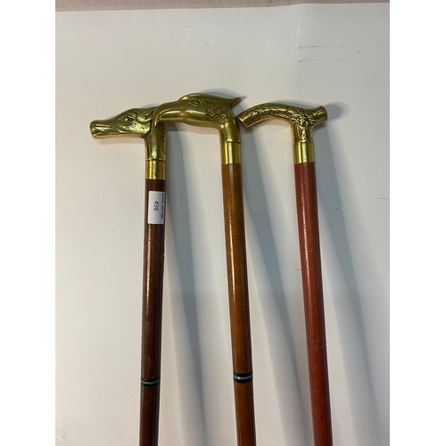 498 - 3 brass headed walking sticks.