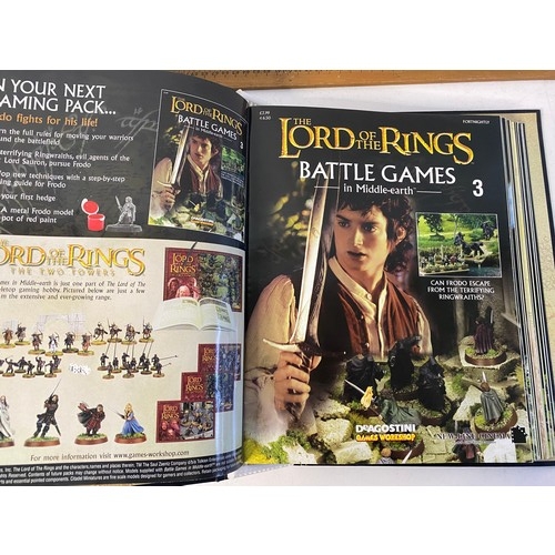 25 - Lord of the Rings battle games and Middle Earth magazines in folder.