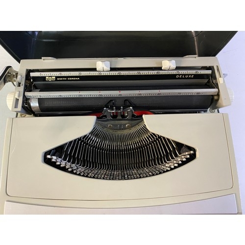 154 - 2 vintage Typewriters, a Smith Corona Courier and Zephyr Deluxe.