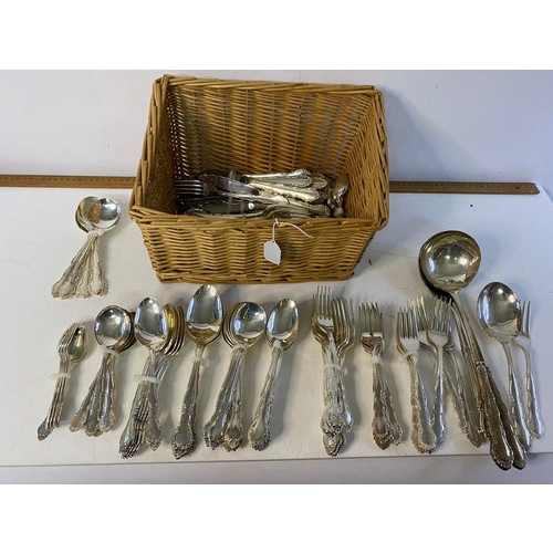 215 - Basket containing approximately 125 pieces of silver plated items of cutlery.