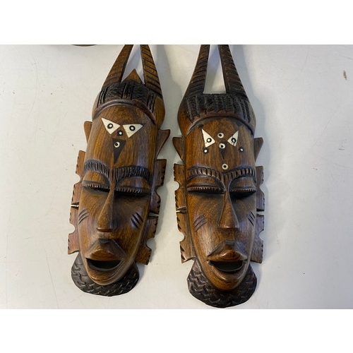 437 - Selection of 4 x African wooden masks, largest measuring 40 cms