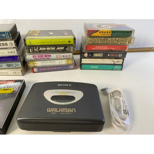 616 - Sony WM-EX 342 Walkman in working order with a selection of cassette tapes