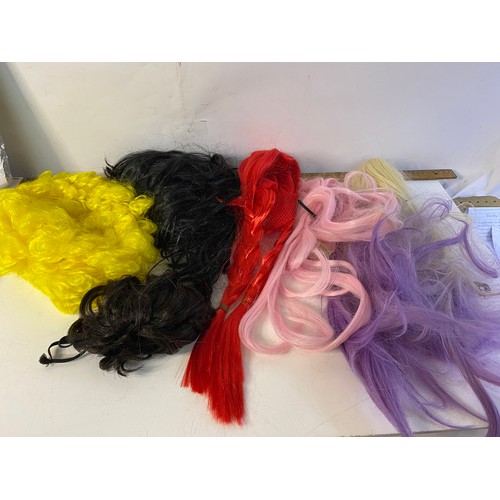 620 - Selection of fancy dress wigs.