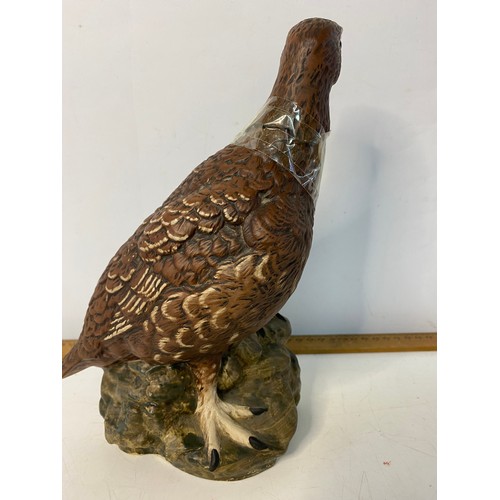 643 - Royal Doulton Matthew Gloag Famous Grouse decanter and a Beswick JG Tongue Golden Eagle decanter.