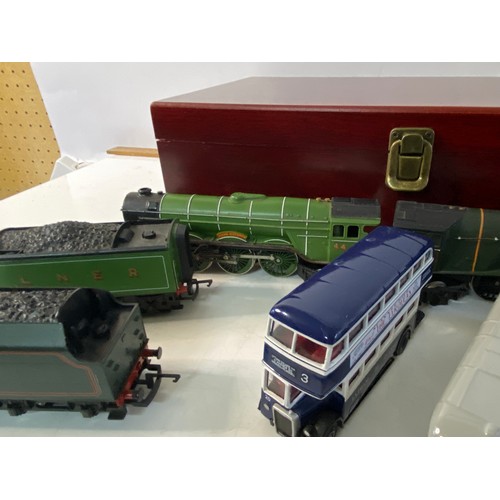 648 - Selection of model buses and trains including Flying Scotsman, Mallard and Blackpool buses.