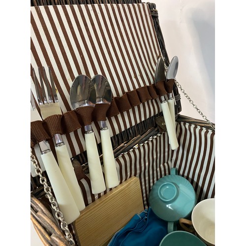 689 - Vintage wicker picnic hamper and contents including melamex cups and saucers.