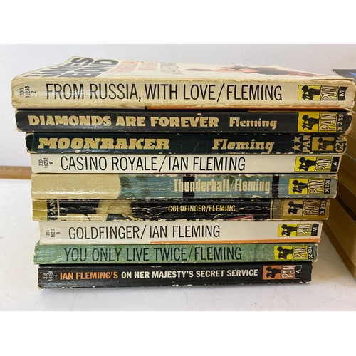 696 - Selection of vintage paperback books including 9 James Bond, Biggles and Agatha Christie