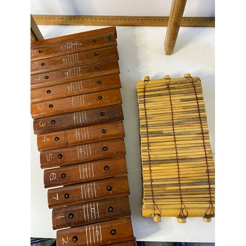 702 - Assortment of vintage musicmakers including washboard and rain stick.