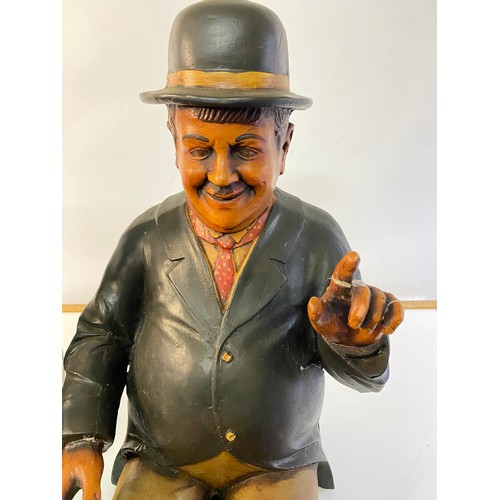 881 - Resin Laurel and Hardy figures measuring approx 63 cms tall, some damage