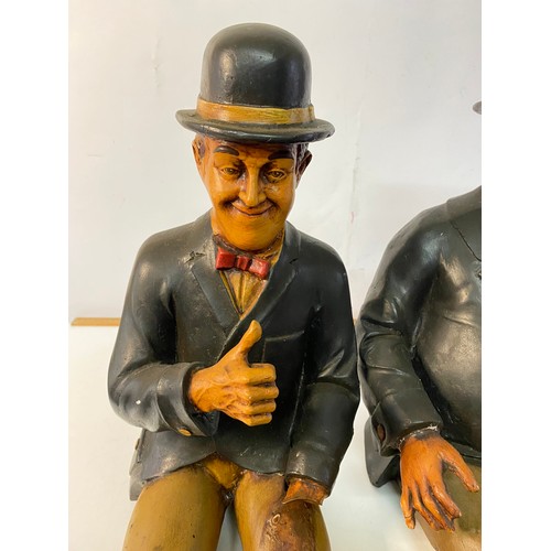 881 - Resin Laurel and Hardy figures measuring approx 63 cms tall, some damage