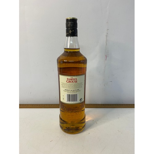 501 - 1 Litre bottle of Famous Grouse scotch whisky.