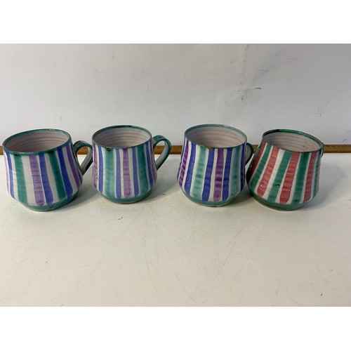 529 - 7 x rare Tintagel Pottery mugs, some nibbles.