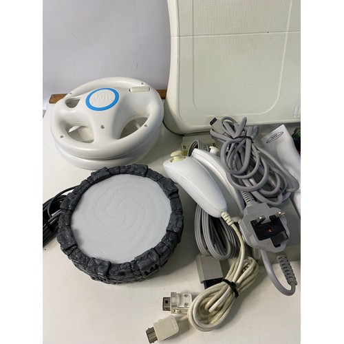 705 - Nintendo Wii console with games and accessories including fit board, Skylanders bundle etc. Front pa... 