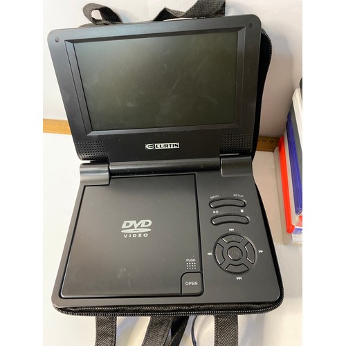 710 - Curtis portable DVD player with a selection of family DVD's. Working order