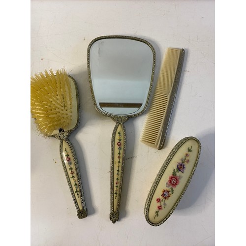 814 - Vintage dressing table set comprising hair brush, clothes brush, comb and a mirror, handle needs rep... 