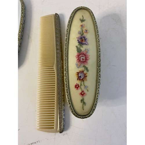 814 - Vintage dressing table set comprising hair brush, clothes brush, comb and a mirror, handle needs rep... 