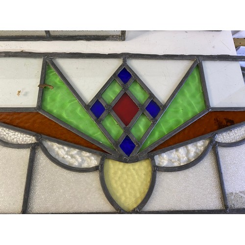 827 - Set of 4 x stained glass windows measuring approx 63 x 30 cms and a matching smaller window measurin... 