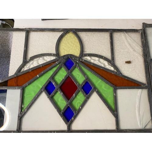 827 - Set of 4 x stained glass windows measuring approx 63 x 30 cms and a matching smaller window measurin... 