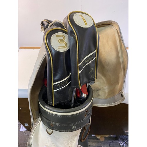 664 - Slazenger golf bag with an assortment of clubs.