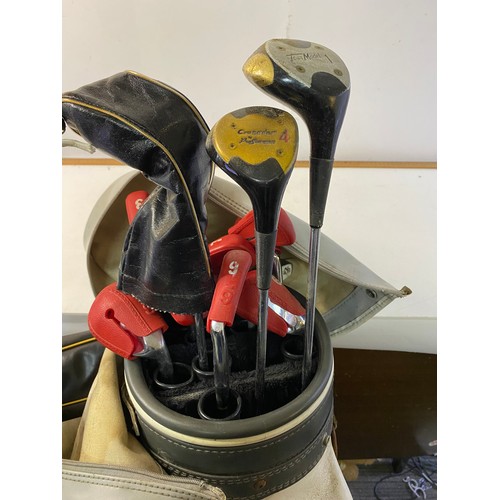 664 - Slazenger golf bag with an assortment of clubs.