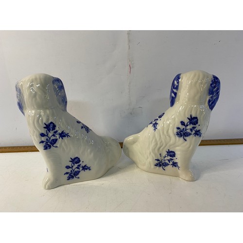 747 - Pair of blue and white Staffordshire dogs, 22 cms tall