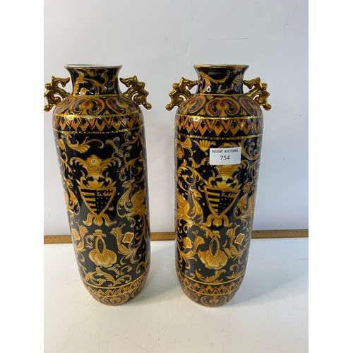 754 - Pair of decorative 36 cms tall Chinese vases and a matching jug