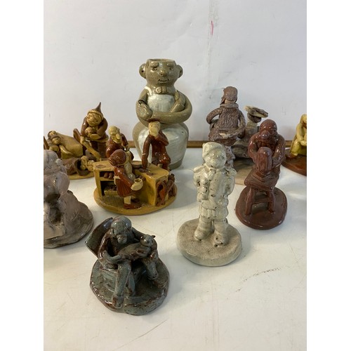 913 - Large collection  of Big Nose Studio pottery figures. Tallest is 16cms