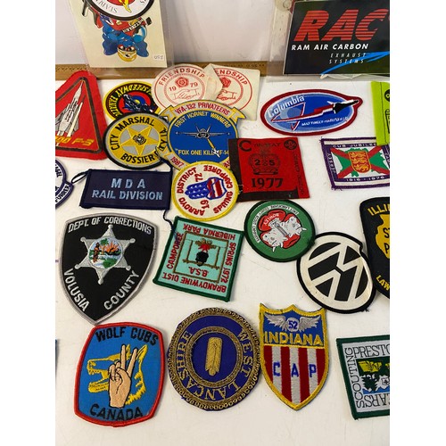 936 - Large collection of patches and stickers from Space, motorcycle, Police and Scouts.