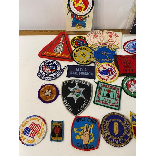 936 - Large collection of patches and stickers from Space, motorcycle, Police and Scouts.