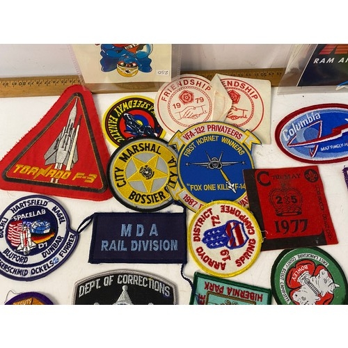 936 - Large collection of patches and stickers from Space, motorcycle, Police and Scouts.