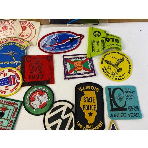 936 - Large collection of patches and stickers from Space, motorcycle, Police and Scouts.