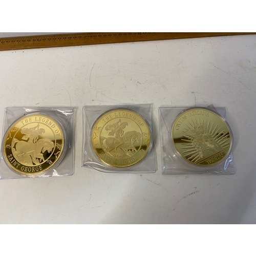 1006 - Set of 3 large gold tone commemorative coins of St George and the Dragon, St George baptises the Kin... 