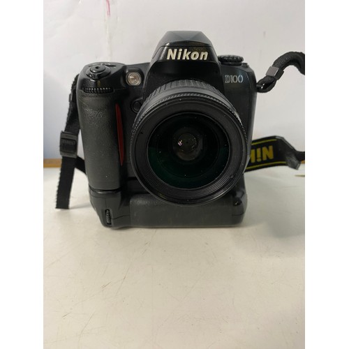 137 - Nikon D100 camera with lens, battery pack, charger and case.