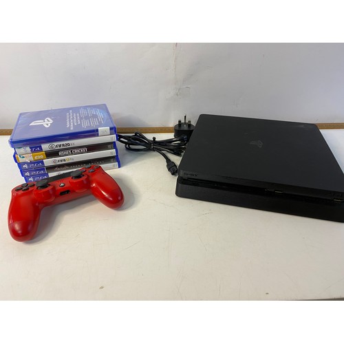 145 - Playstation 4 slim console 1TB with controller and games. Tested and working.