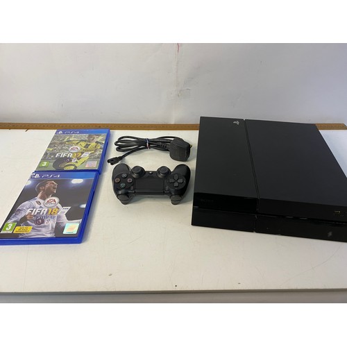 147 - Sony Playstation 4 console with controller and 2 games. Tested and working.