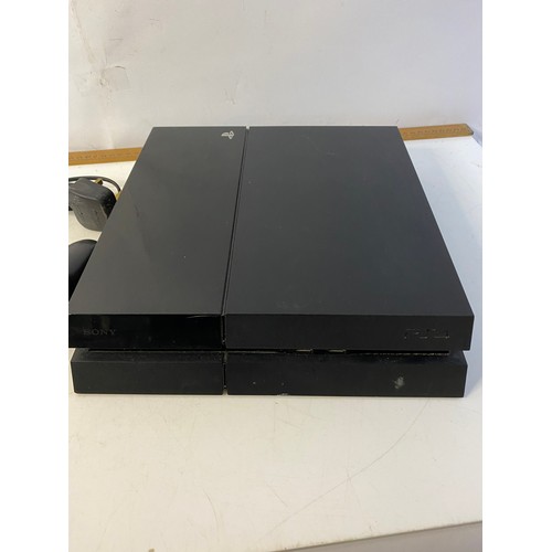 147 - Sony Playstation 4 console with controller and 2 games. Tested and working.