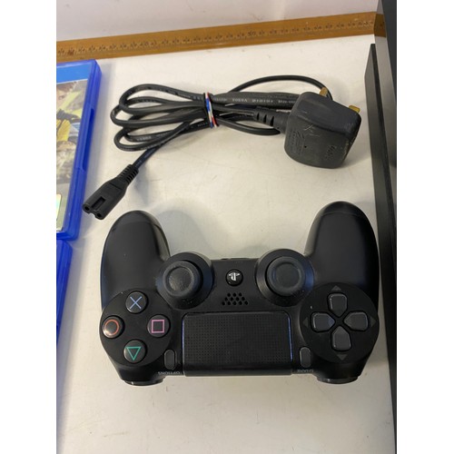 147 - Sony Playstation 4 console with controller and 2 games. Tested and working.