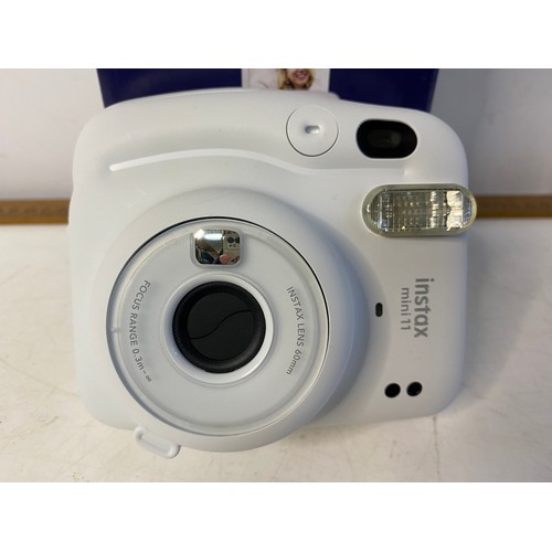 152 - Fugifilm instax mini instant camera in box. No film included but it is available to buy online.