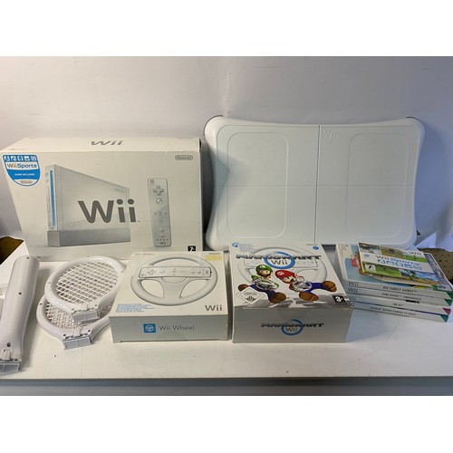 170 - Nintendo Wii with games and accessories including fit board, Mariokart, sport pack and more. Tested ... 